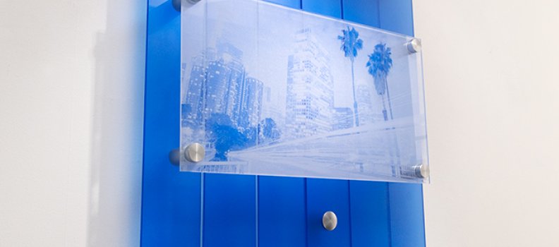 This art installation uses Standoffs and Low Profile Caps. Etched by Radiance Glass in front of blue Lumicor resin panels.